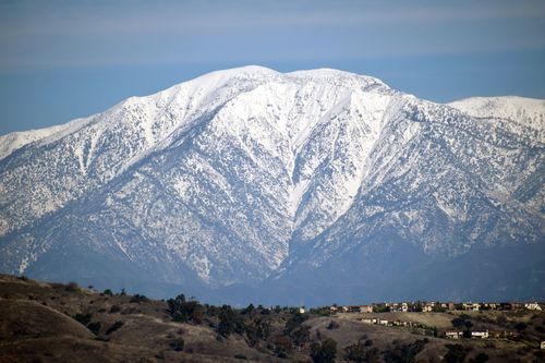 A snapshot of the snow-capped peak of Mount Baldy as seen from Los Angeles County, California.