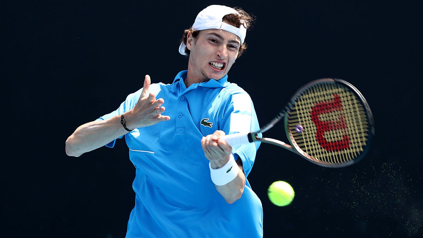 Ugo Humbert of France in action against Richard Gasquet during day two of the 2022 Australian Open 