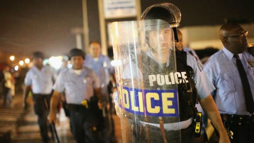 Police on guard during curfew in Ferguson, Missouri. (Getty)