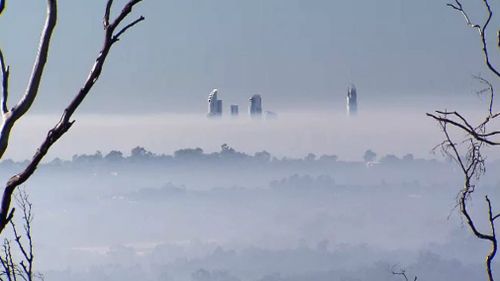 The skyscrapers peek above the smoke. Picture: 9NEWS