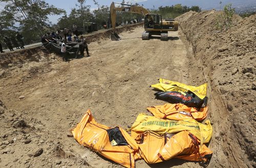 A mass grave is being dug for the victims.