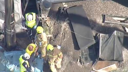 The moment the driver walked from the crumpled front cab of the truck. (9NEWS)