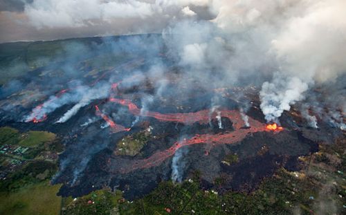 Huge rivers of lava snaking its way toward the sea, and a massive flow headed toward the Puna Geothermal Venture plant. (Photo: AP).