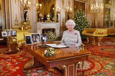 Queen Elizabeth and Prince Philip sign Christmas cards for royal staff  