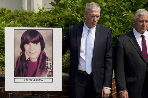 Suffolk County District Attorney Raymond Tierney, unseen, speaks at a news conference to announce the identity of a victim investigators had called the "Jane Doe No. 7," as Karen Vergata, pictured at left, Friday, Aug. 4, 2023, in Hauppauge, New York. Law enforcement authorities said Friday they have identified a woman whose remains were found as far back as 1996 in different spots along the Long Island coast, some of them near the Gilgo Beach locations of bodies investigators believe were left 