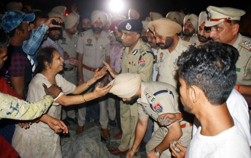 The Press Trust of India news agency said two trains arrived from the opposite direction on separate tracks at the same time, giving little opportunity to people to escape. 