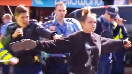 Hayley Garlett said she didn't stop to think when she stepped in front of the police line. (9News)