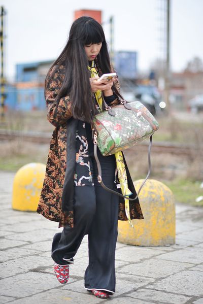 Susie Lau of <em>Style Bubble</em> piles on her signature clash of
print and silhouette in Gucci outside the Milan show.
