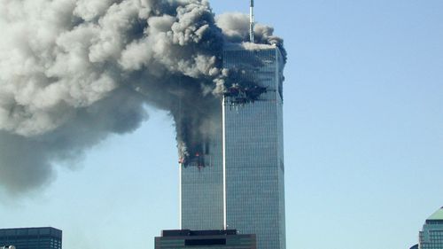 Smoke pours from the World Trade Center after being hit by two planes on the morning of September 11, 2001.