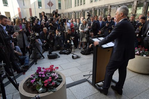 With a squealing grandson at his feet, and family, colleagues and sobbing staff members watching on, he stood in the Prime Minister's courtyard at Parliament House and named names.