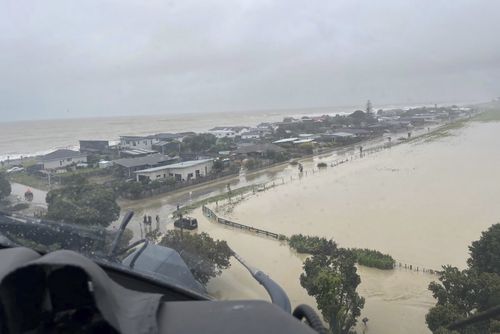 In this image released by the New Zealand Defense Force on Wednesday, Feb. 15, 2023, homes in the Esk Valley, near Napier, New Zealand, are flooded. 