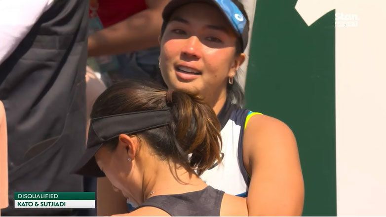 Aldila Sutjiadi consoles Miyu Kato after the pair were defaulted at Roland-Garros.