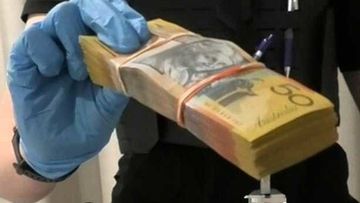 The wads of cash, totalling to $640,000, are believed to be the proceeds of crime.