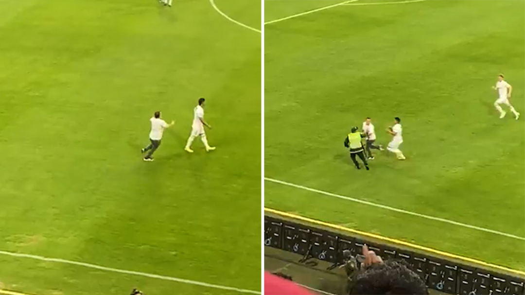 Colombian football match suspended after fan attacks a player, who then chases him in retaliation