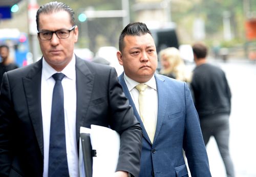NSW Labor's community relations director Kenrick Cheah (right) arrives at the ICAC public inquiry into allegations concerning political donations, Sydney.