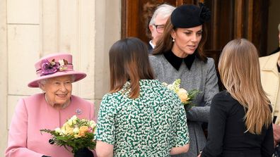 The royal duo are greeted by officials at the college.