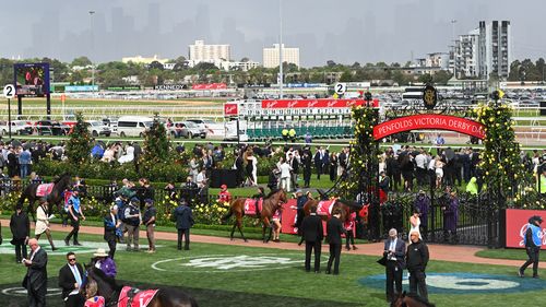 Rain, wind, hail to chill racegoers at Melbourne Cup - 9News