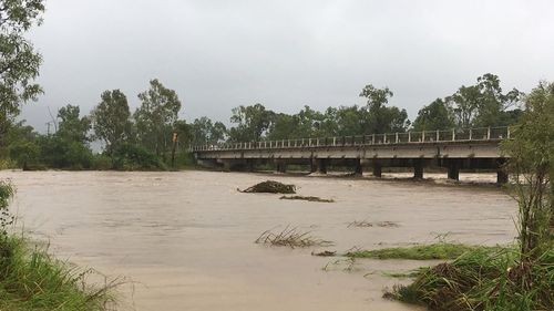 The Ross River swollen after heavy  rainfall.(Image: Tom Fowles/9NEWS)