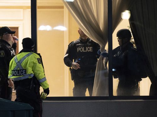 York Regional Police tactical officers work the scene of a fatal shooting in Vaughan, Ontario. Authorities said multiple people were shot and killed in a condominium unit in the Toronto suburb and the gunman was killed by police.  