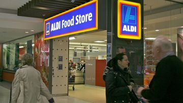 Aldi worker customers eating grapes