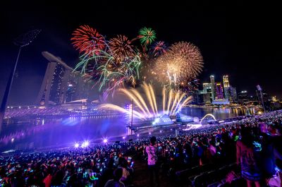 Fireworks explode over the Marina Bay at the stroke of midnight in Singapore.