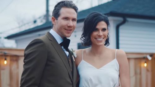 Spencer and Monique Tepe pose on their wedding day.