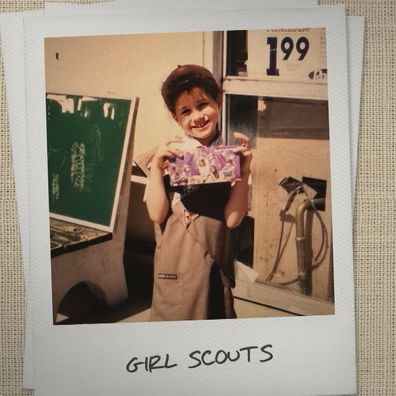 A childhood photo of Meghan Markle as a girl scout in With Love, Meghan