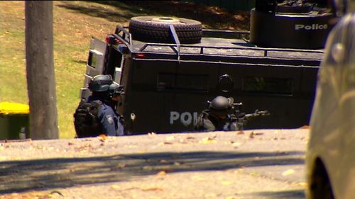 Armed police outside the home. (NBN News)