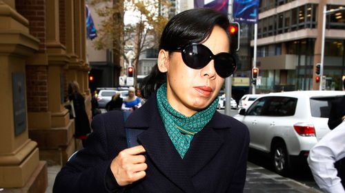 Kathy Lin, wife of accused murderer Robert Xie leaves the Sydney Supreme Court after giving evidence. (AAP)