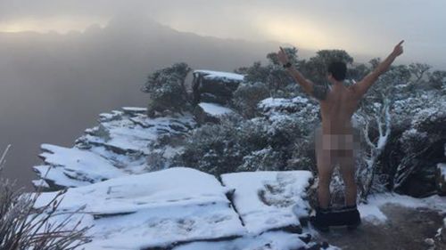 A little cheeky: two mates took photos after a rare snowfall in Bluff Knoll in WA. (Facebook)