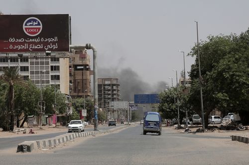 Smoke is seen rising from a neighborhood in Khartoum, Sudan, Saturday, April 15, 2023. 