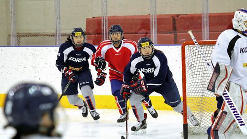 Women hockey players from North and South korea train as part of a combined team in the lead-up to the Winter Olympics. (Photo: AP).