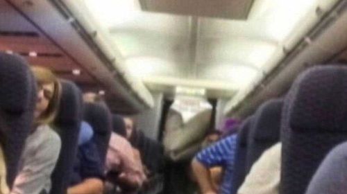 Plane's exit chute bursts open in mid-air