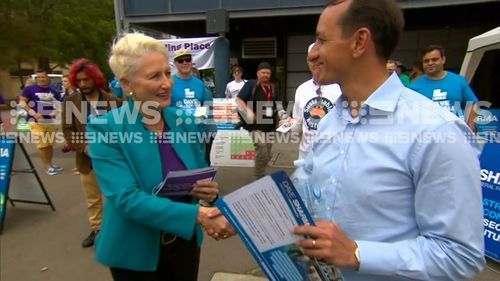 Independent Kerryn Phelps and Liberal Dave Sharma shake hands on voting day.