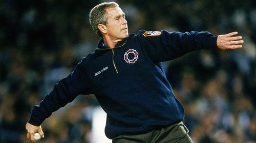 US President George W. Bush throws the ceremonial first pitch prior to game three of the 2001 World Series.