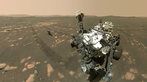 Just days after NASA's Perseverance rover gently dropped the Ingenuity helicopter on the surface of Mars, the robot companions took a selfie together on Tuesday and beamed it back to Earth.