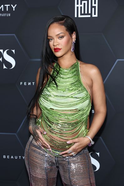 Rihanna poses for a picture as she celebrates her beauty brands fenty beauty and fenty skin at Goya Studios on February 11, 2022 in Los Angeles, California. 