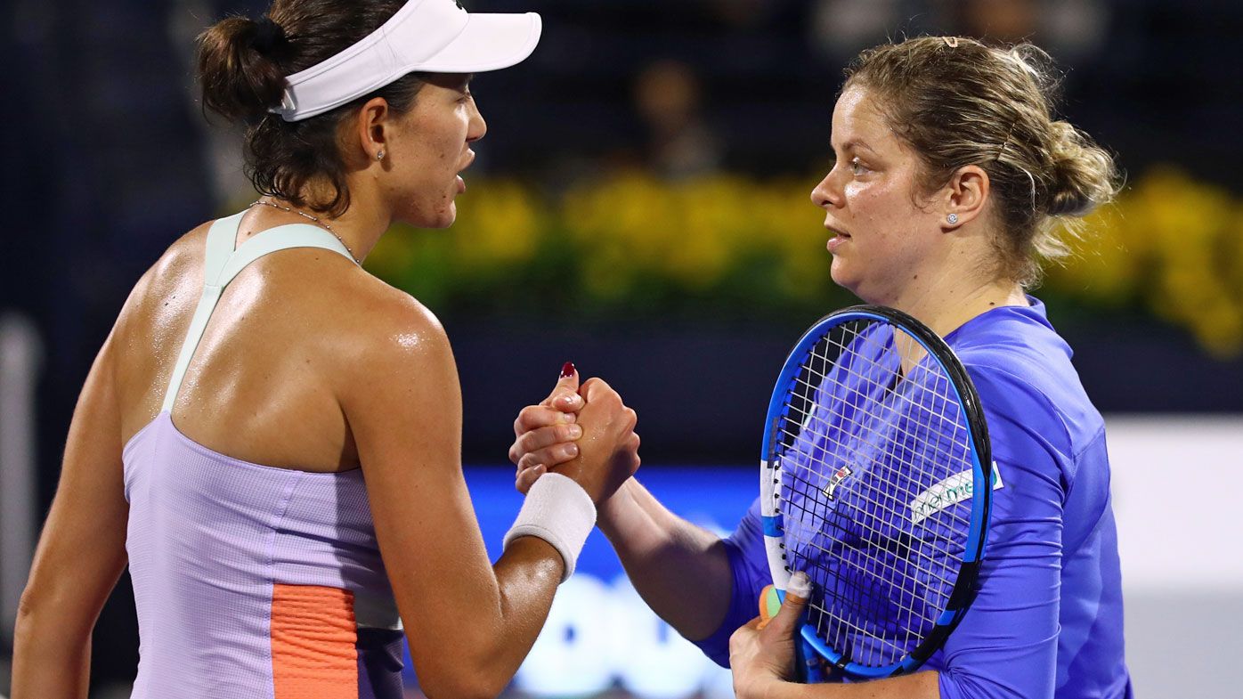  Garbine Muguruza of Spain is congratulated by Kim Clijster of Belguim against after winning her Women&#x27;s Singles match on Day One of the Dubai Duty Free Tennis Championships 