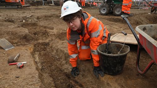 Helen Wass, Head of Heritage at HS2, over the burial site.