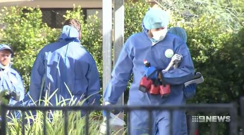 Forensic officers were seen walking in and out of the Toowoomba property. (9NEWS)