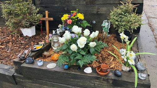 A shrine dedicated to the memory of Justine Ruszczyk next to the alleyway in which she was fatally shot.