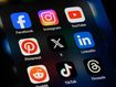 Toronto, Canada - September 24, 2023:  Popular social media apps on an Apple iPhone: Facebook, Instagram, YouTube, Pinterest, X (formerly Twitter), LinkedIn, Reddit, TikTok, and Threads.