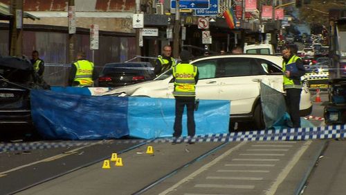 The woman was pinned against another vehicle, suffering catastrophic injuries. She died at the scene. (9NEWS)