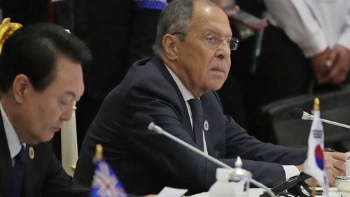Sitting next to South Korea President Yoon Suk Yeol, left, Russian Foreign Minister Sergey Lavrov listens during the ASEAN Australia-New Zealand Trade Area (AANZTA) in Phnom Penh, Cambodia.