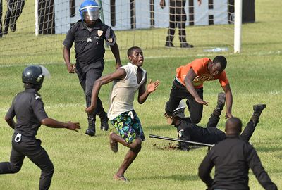 Police tried to round up the pitch invaders in farcical scenes.