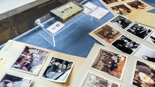 A view of photos and a cassette with the recording of four Danish schoolboys' interviews with John Lennon and Yoko Ono during the famous couple's winter stay in Thy, in Jutland, Denmark.