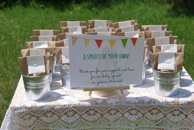 <p>Baby Sprout Seed Pots</p>
<p>A unique party favour for a baby shower is a <a href="http://thesweetestdigs.com/the-diy-files-plant-pots-baby-shower-favours/" target="_blank" draggable="false">seed in a pot</a> gift. Pop seeds in <a href="https://www.spotlightstores.com/favours/loot-bags-boxes/party-loot-bag-10-pack/p/BP80234635" target="_blank" draggable="false">small paper bags</a>, write on some <a href="https://www.bunnings.com.au/gardman-127mm-plastic-tee-plant-label-50-pack_p2961057" target="_blank" draggable="false">plant labels</a> and pop them in a little pot with some soil. You can buy <a href="http://www.kmart.com.au/product/wire-basket-with-pots-set/699851" target="_blank" draggable="false">six mini terracotta pots</a> in a wire carrier for $12 from Kmart.</p>