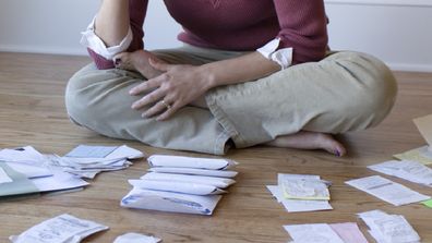 Woman pile of bills
