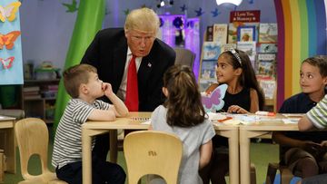 President Donald Trump talks with a group of children during a visit the Nationwide Children's Hospital.