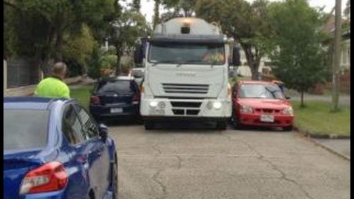 People are being forced to park on the street, restricting movement on the road.